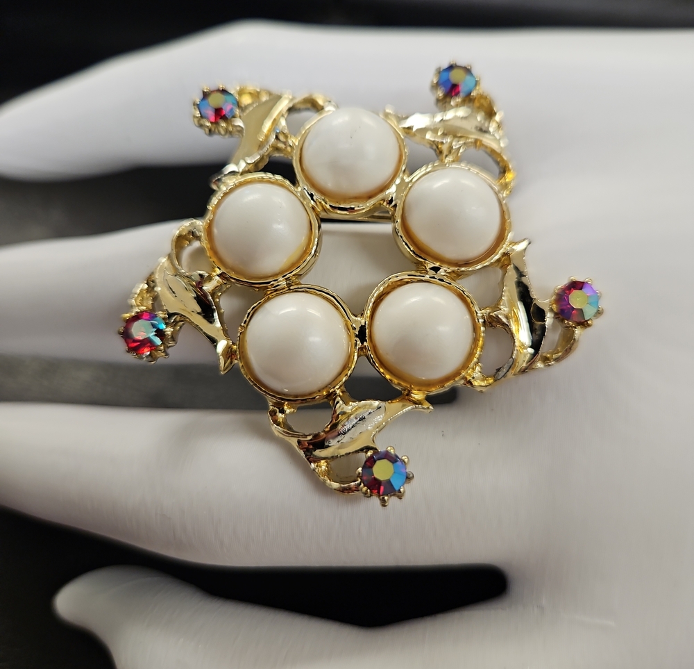 Gold-Tone White Cabochon Floral Brooch with Multicolor Rhinestone Accents